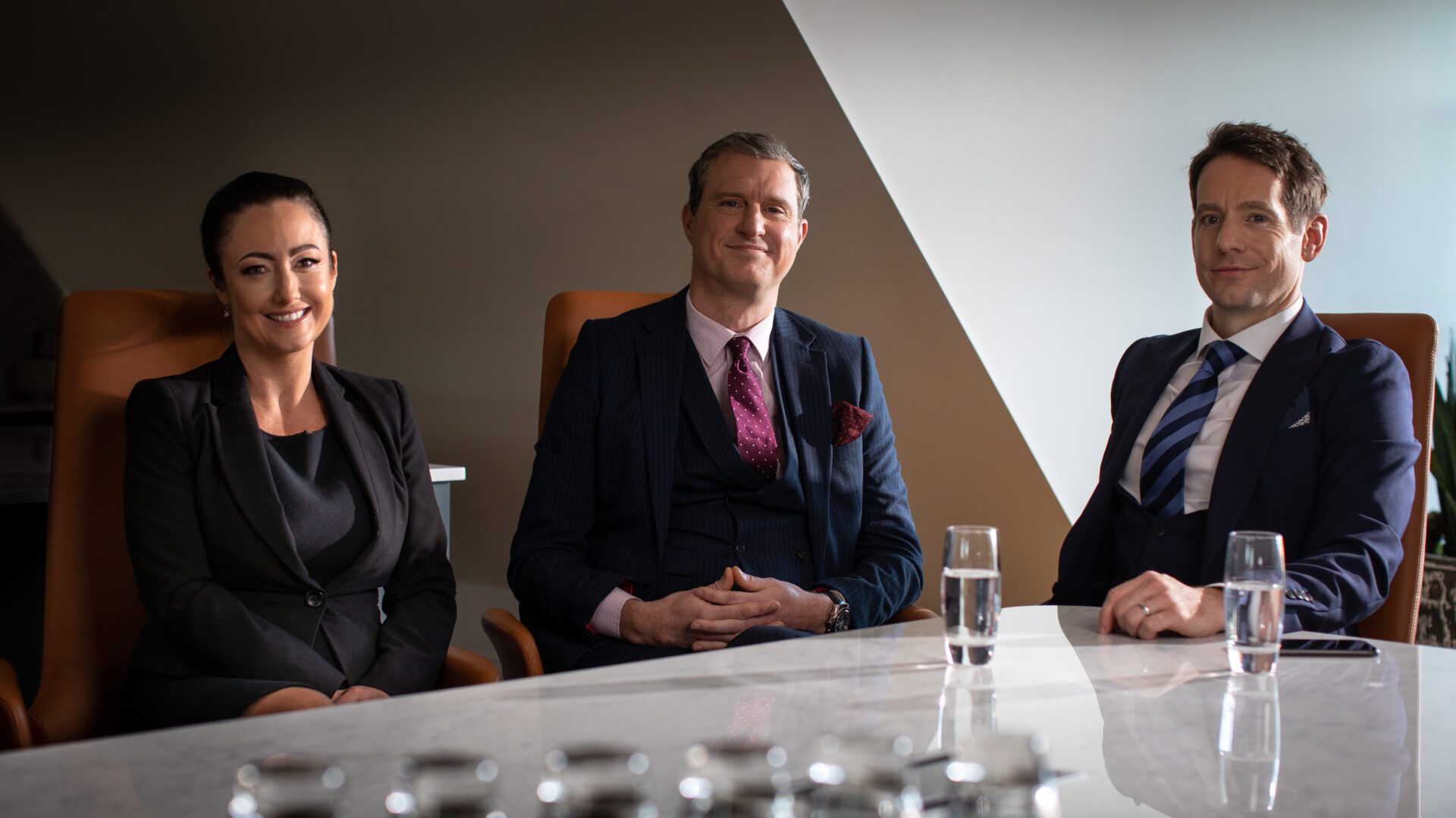 Staff at meeting table with water